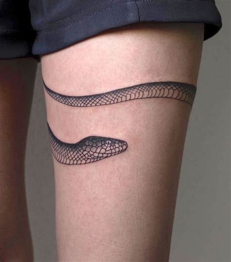 snake wrapped around thigh tattoo